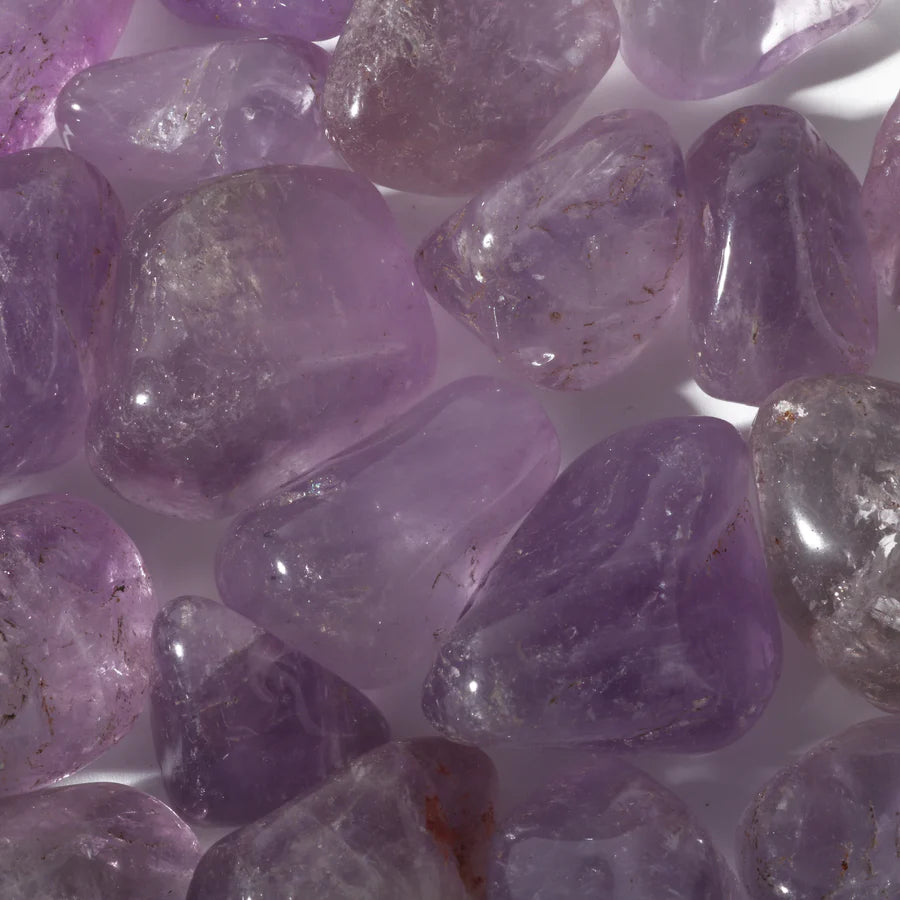 Smooth polished amethyst pocket stone for spiritual protection and third eye activation