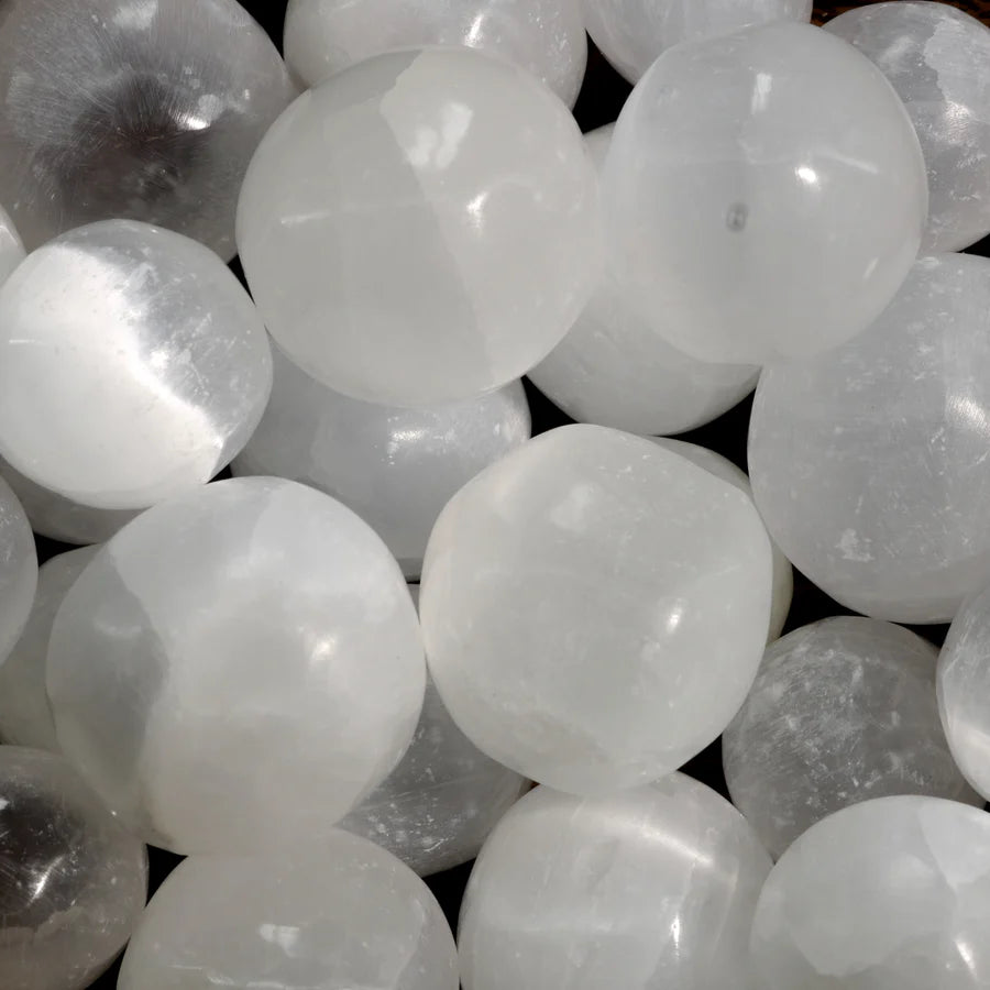 Pure white selenite tumbled stones for crown chakra purification and spiritual cleansing