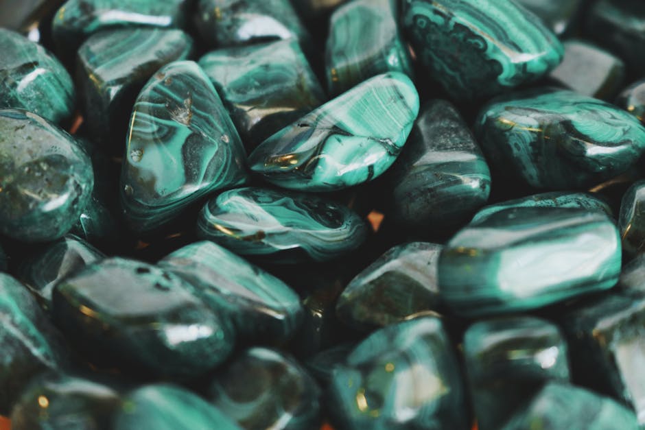 Polished malachite stone with green bands and patterns