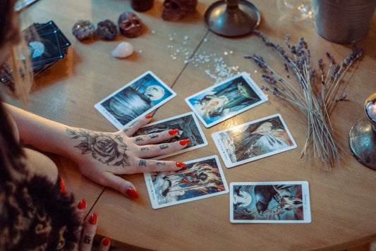 Tarot cards spread on table with crystals - divination and self-discovery