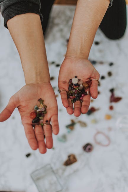 Hands holding colorful energy crystals for vitality