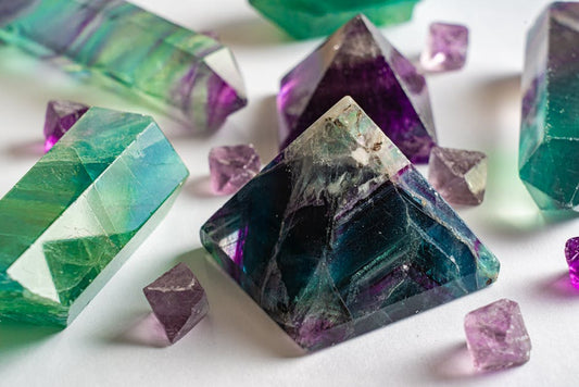 Colorful fluorite crystal with purple and green bands