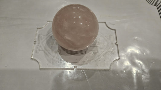 Single rose quartz sphere 40mm hero shot on sacred geometry acrylic stand