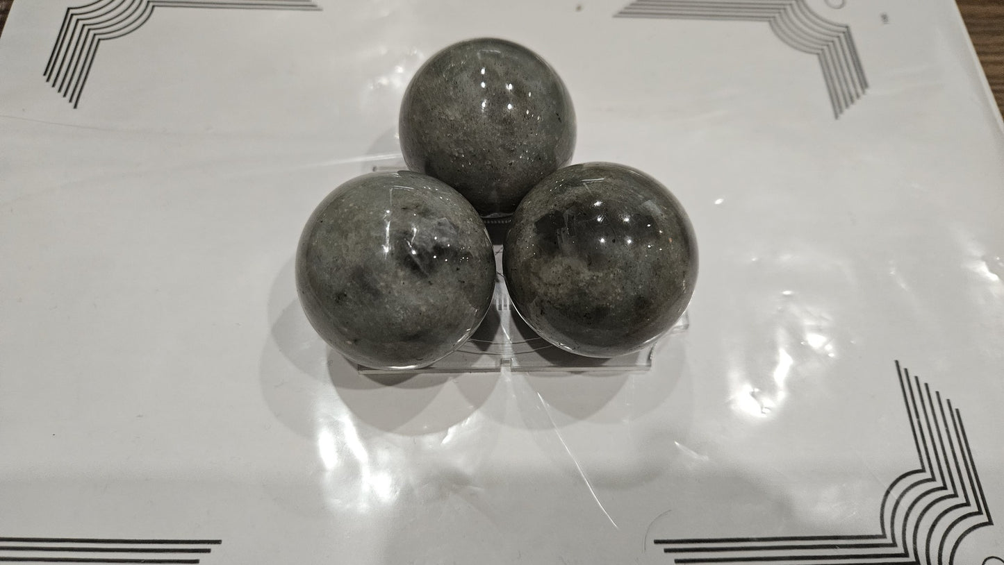 Three 40mm labradorite spheres triangular set with blue and gold flash